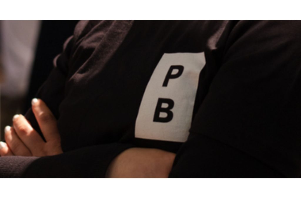 Close up shot of a black sustainable printed T-shirt