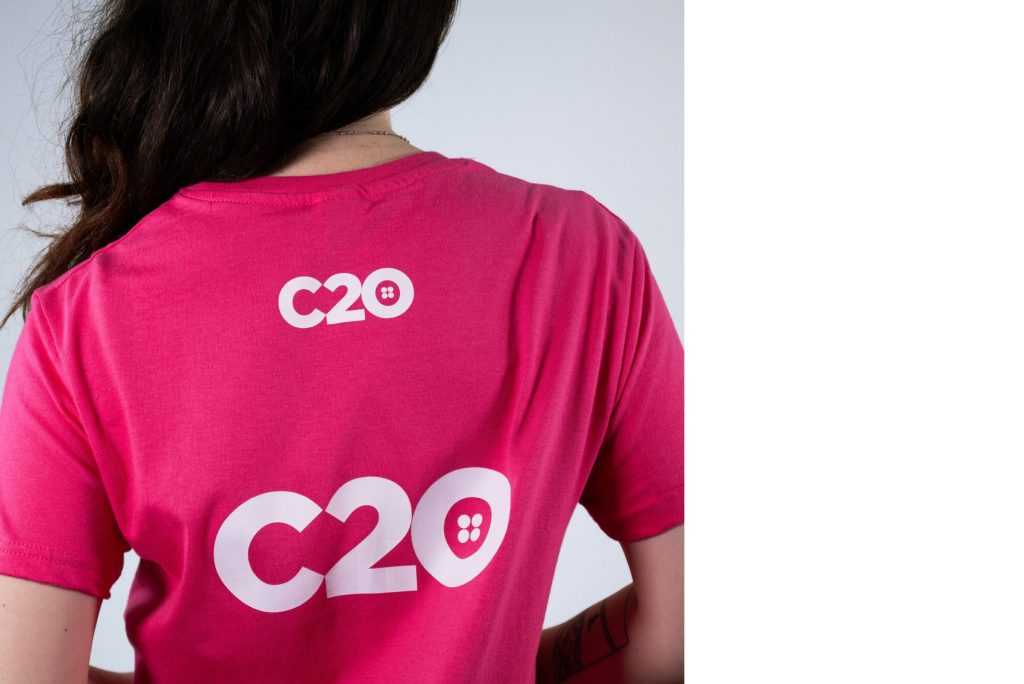 Pink t-shirt featuring Top Back logo placement.