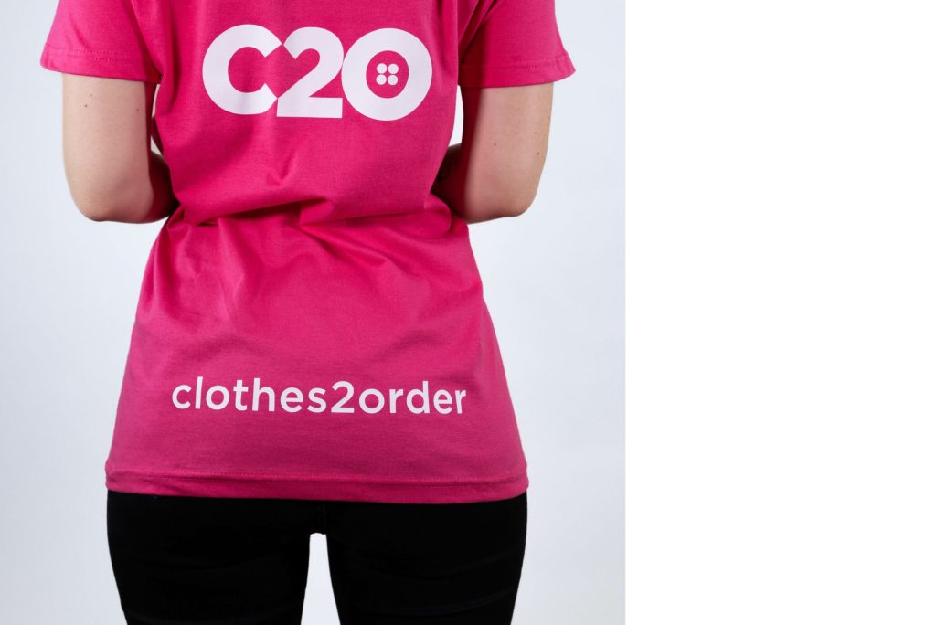 Pink t-shirt featuring Bottom Back logo placement.