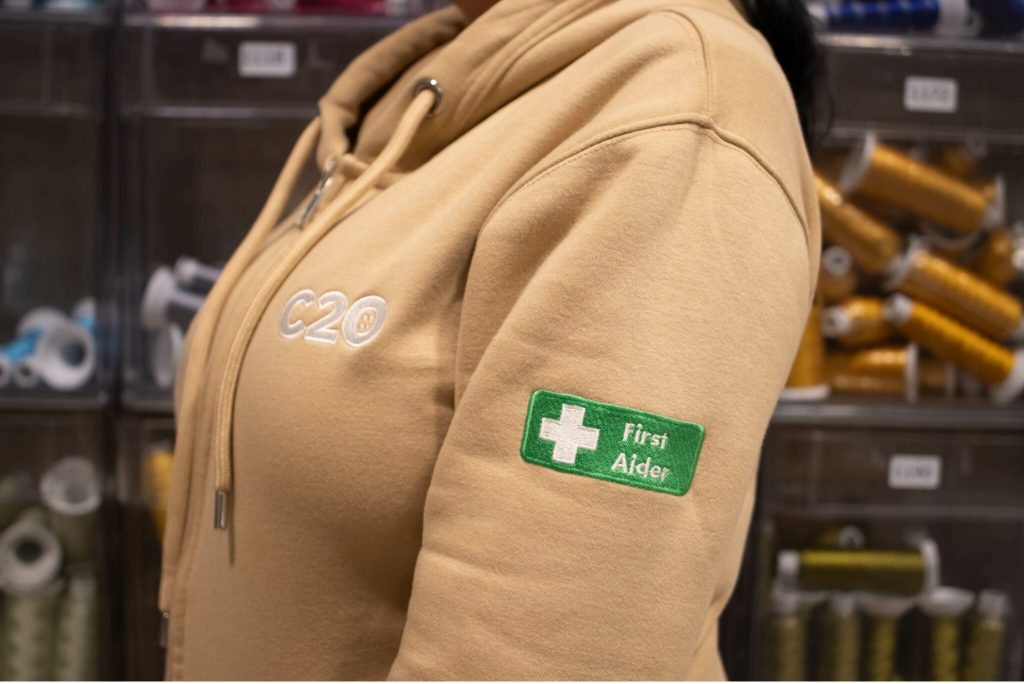 Demonstrating how an embroidered logo would look on the sleeve of a jumper