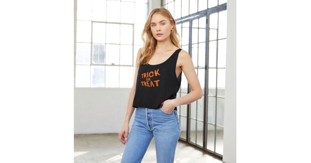 A black sleeveless tank top with "Trick or Treat" written on the front