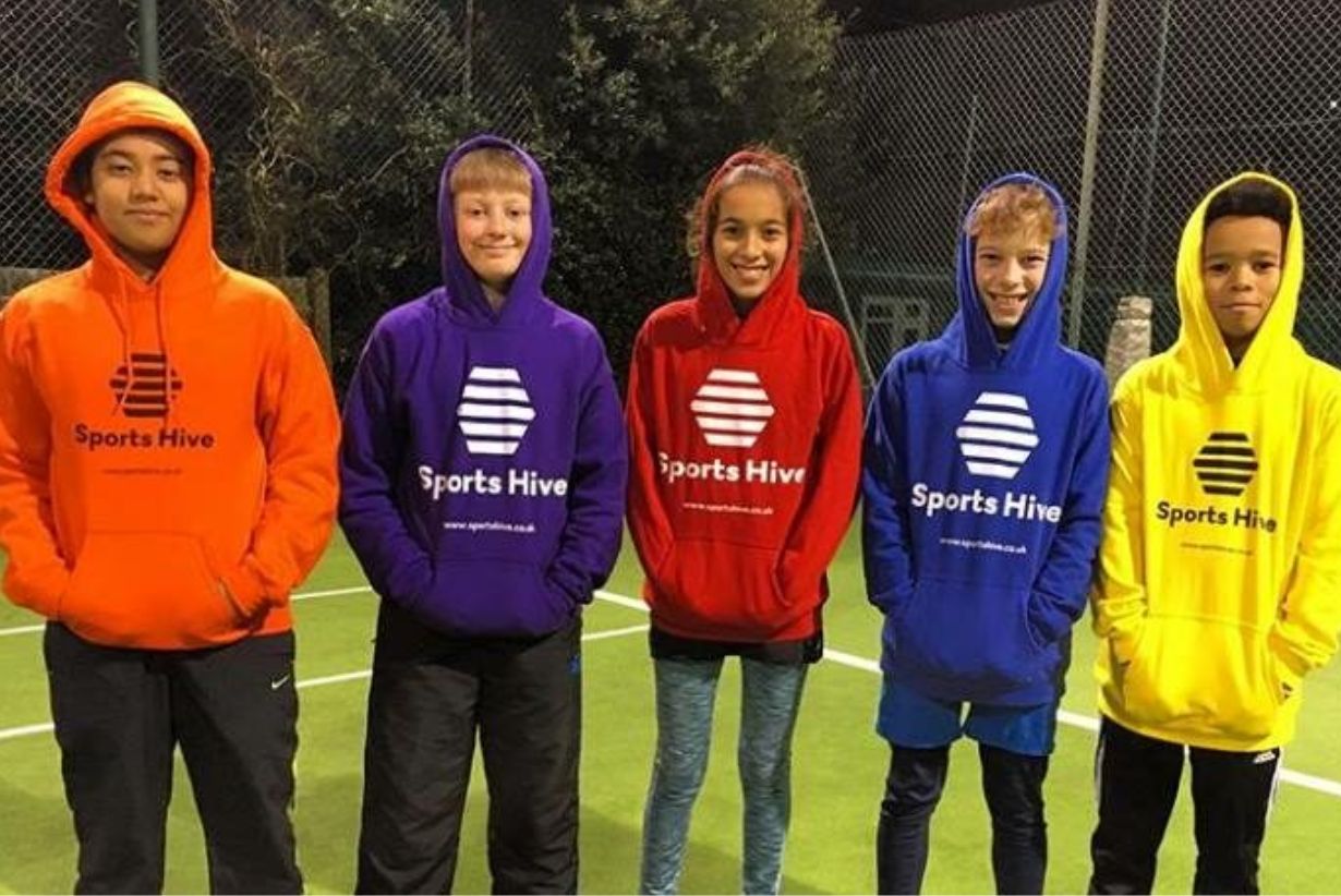 jumpers in orange, purple, red, blue, and yellow with different coloured logos. These jumpers have a logo printed for Sports Hive in the centre of the jumper.