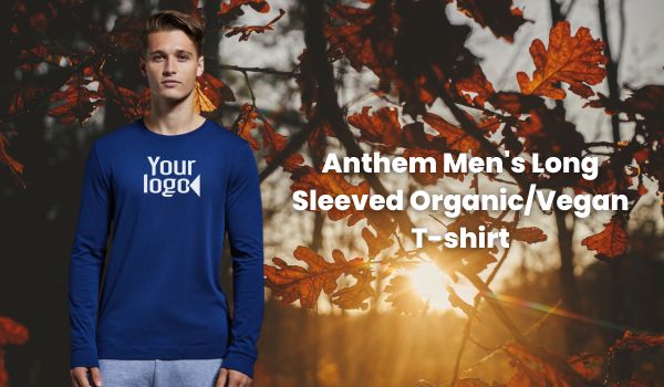 Man wearing a custom Anthem Men's Long Sleeve Organic Vegan T Shirt on an autumn wood background